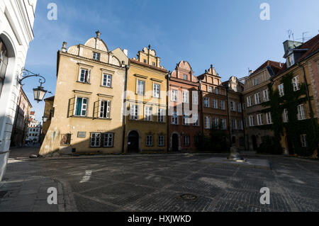 One of the popular tourist attractions id the  huge 17th century cracked bronze bell on small triangle Kanonia Square in the Old Town of Warsaw, Warsa Stock Photo
