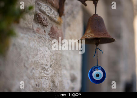 Rusted metal bell and amulet doorbell. Stock Photo