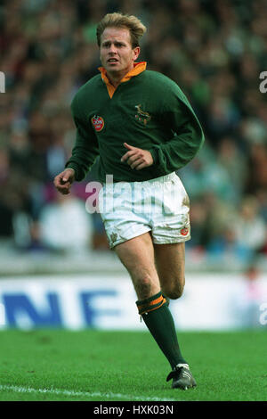 Laurent Cabannes of France passes the ball as Naas Botha of So- Old Rugby Photo | UK