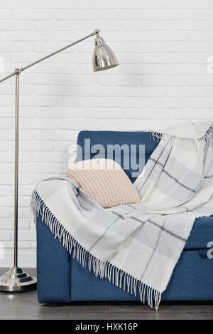 Grey sofa against brick wall in the room Stock Photo Alamy