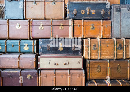 Many old suitcases stacked up Stock Photo