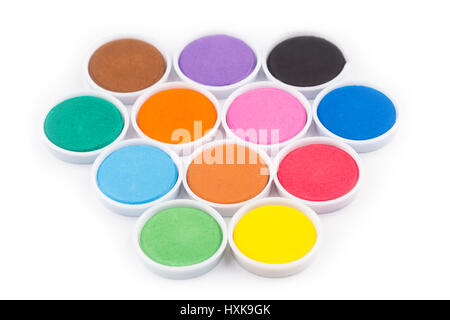 low angle closeup of water color palette in white plastic containers isolated on white selective focus Stock Photo