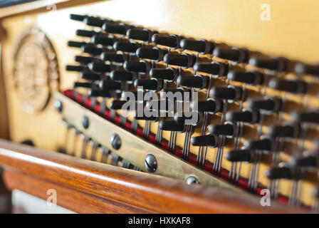 Upright piano pegs detail Stock Photo