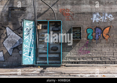 Old electrical cabinet open and empty in abandoned hangar Stock Photo