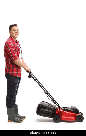 Full length portrait of a gardener with a lawnmower isolated on white background Stock Photo