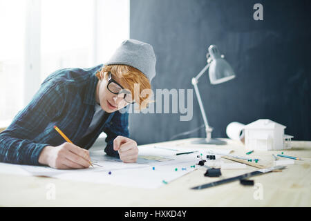 Young Architect Working on House project Stock Photo