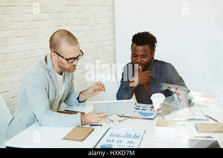Effective teamwork of businessmen Stock Photo