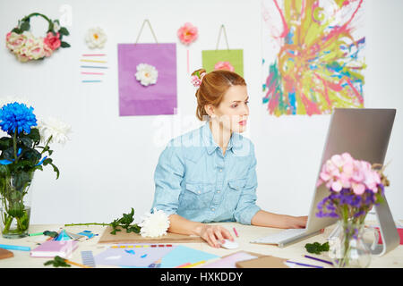 Graphic designer wrapped up in work Stock Photo