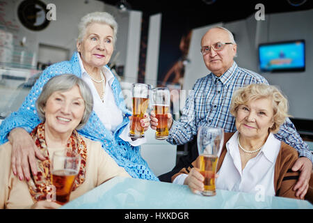 Hanging out in pub with friends Stock Photo