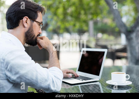 Having coffee break in outdoor cafe Stock Photo