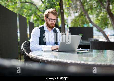 Working under shade of trees Stock Photo