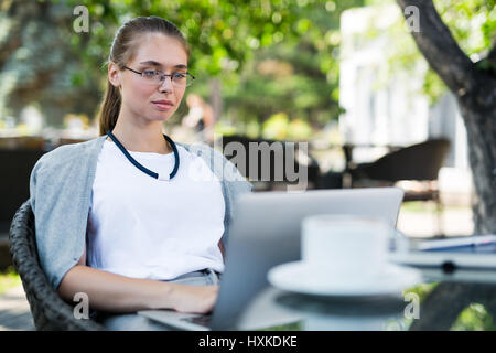 Busy financial manager in outdoor cafe Stock Photo