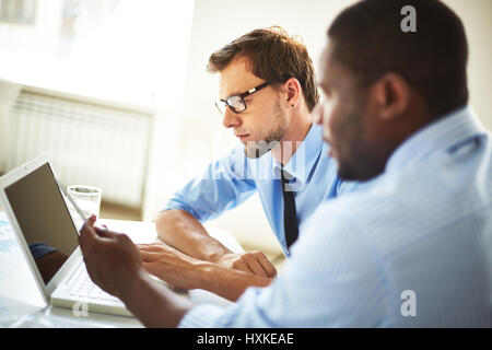 Financial managers wrapped up in work Stock Photo