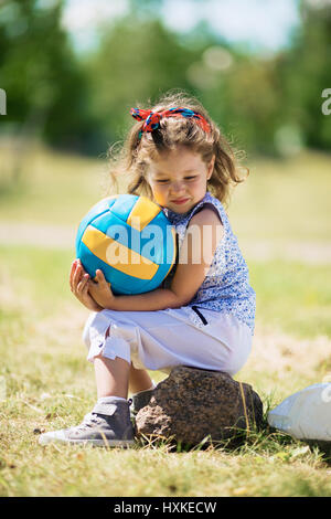 Little girl with ball Stock Photo