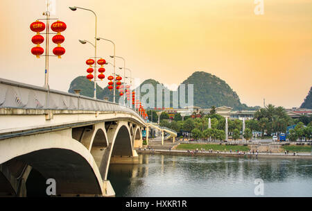 GUILIN, CHINA - SEPTEMBER 22, 2016: Bridge over Li river in the city central area decorated with Chinese red lanterns Stock Photo