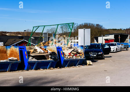 Ronneby, Sweden - March 27, 2017: Documentary of waste management. Cars with trailers at public waste station. Containers full of sorted trash destine Stock Photo