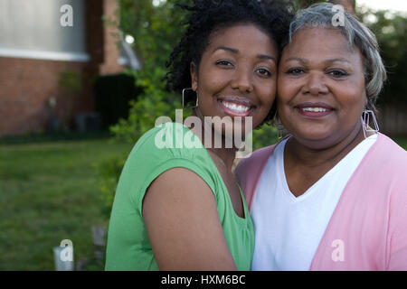 Happy African American mother and her adult daugher.