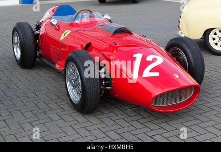 A classic 1958, Ferrari 246 F1 racing car, out for a test session  on the track during the Silverstone Classic Media Day Stock Photo