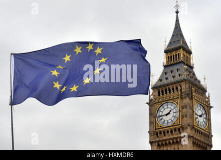 An EU flag flies in front of the Houses of Parliament in Westminster, London, after the letter informing the European Council of Britain's intention to leave the European Union has been handed over to EC president Donald Tusk in Brussels. Stock Photo