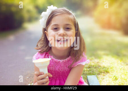 Little girl eating ice cream Stock Photo