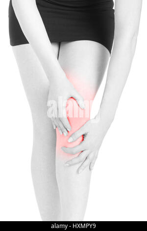 Woman with black dress with knee and legs with red pain area isolated on white, clipping path Stock Photo