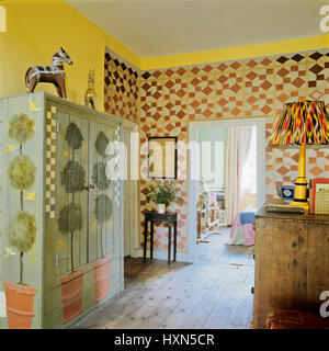 Room with pot plants painted on wardrobe. Stock Photo