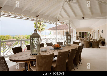 Outdoor seating on veranda of villa Stock Photo
