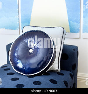 Cushions on blue chaise longue. Stock Photo