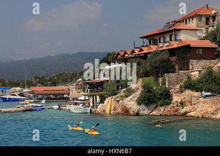 Antalya, Turkey - August 28, 2014: Simena village on the Turkish island of Kekova, Tourists kayaking. Stock Photo