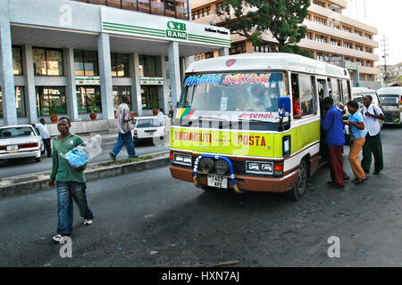Dar es Salaam, Tanzania - February 21, 2008: Local residents of the city of Dar es Salaam in a hurry to enter into a municipal bus, the bus cabin has  Stock Photo