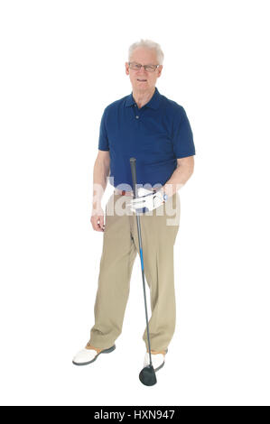 A seventy old senior standing with his blue t-shirt, holding his iron in his hand, isolated for white background. Stock Photo