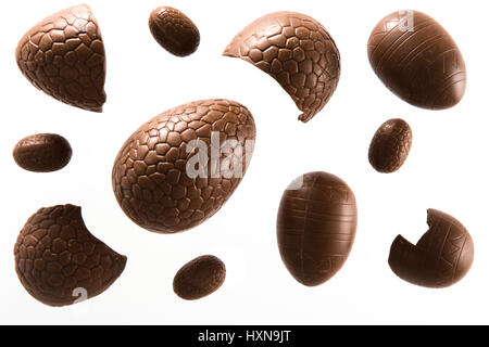 High angle view of a variety of unwrapped Easter chocolate eggs on a white background Stock Photo