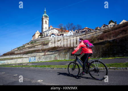 Melnik Czech Republic, Cyclist ride a bike under the Melnik church Europe vineyard road scenery Stock Photo