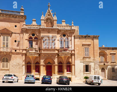 MDINA, MALTA - JULY 29, 2015: The Baroque style facade of the austere Bishop's Palace on the Pjazza San Pawl in Mdina. Malta Stock Photo