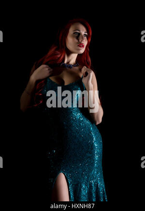 beautiful redhead woman with big tits in a tight dress posing on a dark background Stock Photo - Alamy beautiful redhead woman with big tits in a tight dress posing on a dark background Stock Photo - Alamy
