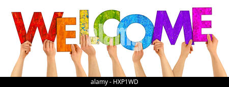 hands holding up colorful wooden letters shaping the word welcome isolated on white background Stock Photo