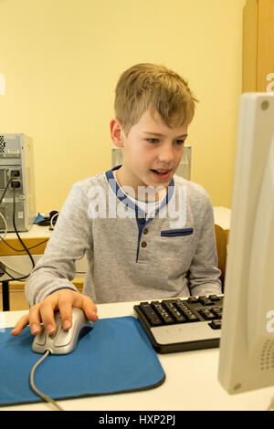 School boy at computer Stock Photo - Alamy