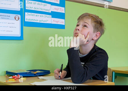 boy writing a test at primary school Stock Photo