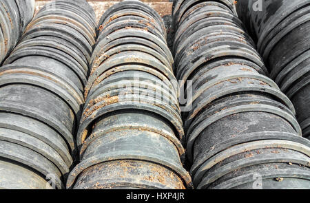 Closeup to Stack of Old Plastic Plant Pot Background Stock Photo