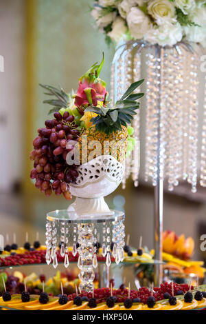 Table setting with fruit for wedding reception with decorations made of crystal Stock Photo