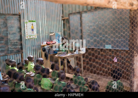 A teacher and her pupils at a Bridge International Academies primary school in Mpigi, Uganda. Stock Photo