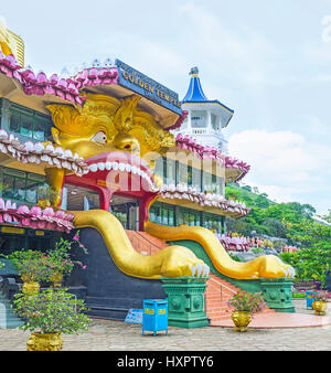 DAMBULLA, SRI LANKA - NOVEMBER 27, 2016: The entrance to the Golden Temple decorated with the sculpture of open lion's mouth with doors inside, the lo Stock Photo