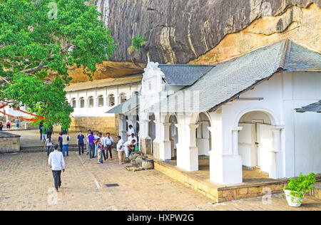 DAMBULLA, SRI LANKA - NOVEMBER 27, 2016: The white facades of the Cave Complex were created to preserve the ancient interiors of the Buddhist Monaster Stock Photo