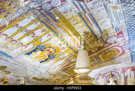 DAMBULLA, SRI LANKA - NOVEMBER 27, 2016: The ceiling of Paccima Viharaya (Western Temple) of Dambulla Cave Monastery, covered with frescoe, depicting  Stock Photo