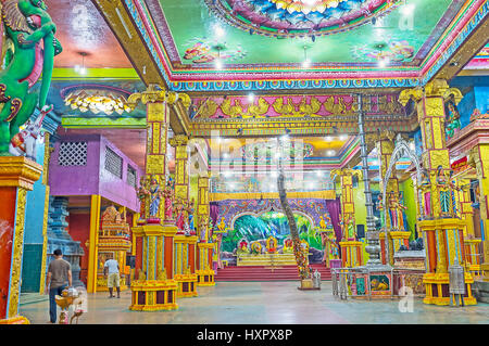 MATALE, SRI LANKA - NOVEMBER 27, 2016: The prayer hall of Muthumariamman Kovil - Tamil Hindu Temple, with colorful sculptures of Gods, floral patterns Stock Photo