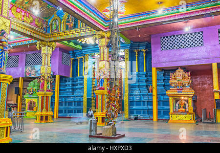 MATALE, SRI LANKA - NOVEMBER 27, 2016: The prayer hall of Muthumariamman Kovil - Tamil Hindu Temple is richly decorated with sculptures, carvings, pai Stock Photo