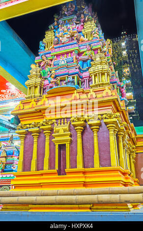 MATALE, SRI LANKA - NOVEMBER 27, 2016: The towers of Muthumariamman Kovil - Tamil Hindu Temple decorated with colorful sculptures and reliefed pattern Stock Photo