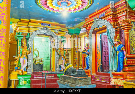 MATALE, SRI LANKA - NOVEMBER 27, 2016: The colorful interior of Muthumariamman Kovil - Tamil Hindu Temple with sculptures of Gods, animals, reliefed d Stock Photo