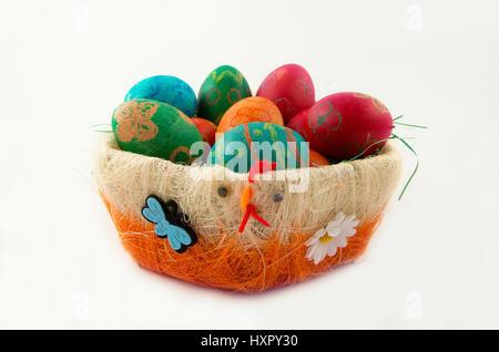 Easter eggs in decorative basket Stock Photo