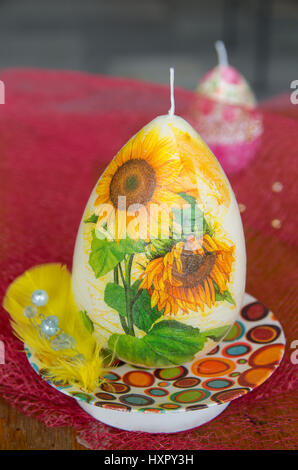Decorated Easter candles in the form of eggs. Stock Photo